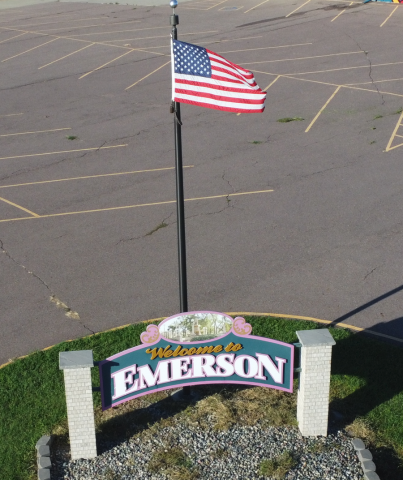 welcome sign with flag